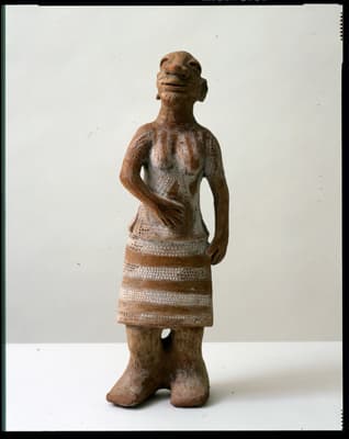 Pregnant Figure Holding Stomach by Reinata Sadhimba
