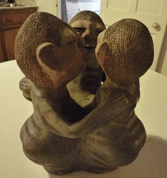Three Female Figures Embracing by Reinata Sadhimba